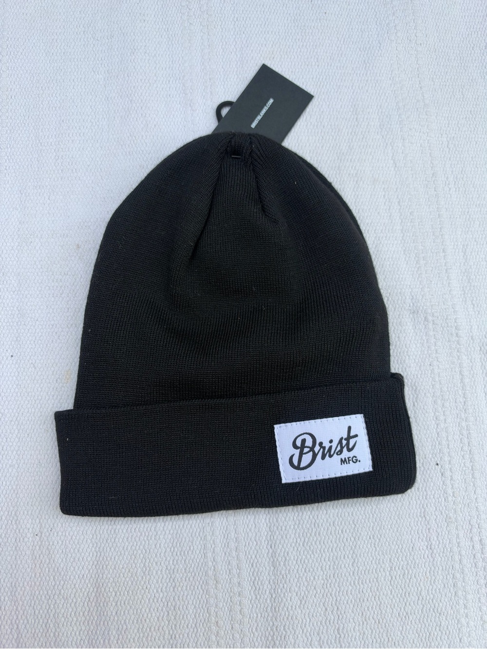 black cuffed beanie featuring a distinctive white "Brist MFG."